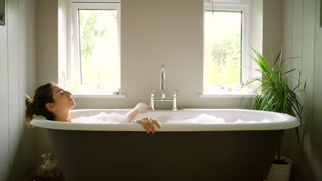 Woman,-bathtub-and-relax-in-bathroom-home