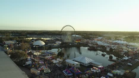 Aerial-View-of-Ferris-Wheel-at-the-Florida-State-Fair-During-Sunset