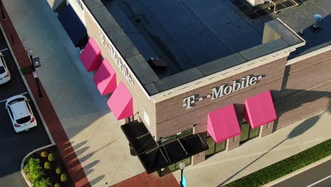 Aerial-drone-shot-of-T-Mobile-cellular-wireless-phone-smartphone-retail-store-exterior