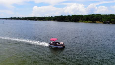 Pontoon-boat-cruising-through-the-sound-past-some-small-islands-near-Destin-Florida