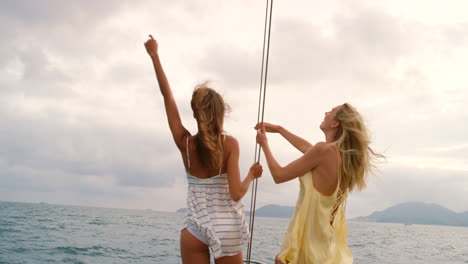 Carefree-happy-women-on-a-yacht-cruise-enjoying