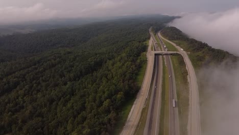 Interstate-75-In-Rarity-Mountain-Road-With-Vehicles-Traveling-By-Dense-Forest-Valley-During-Misty-Morning-In-Newcomb,-Tennessee,-USA