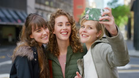Group-of-cheerful-friends-taking-a-selfie