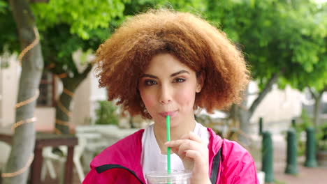 Portrait-of-a-woman-with-a-red-afro-drink