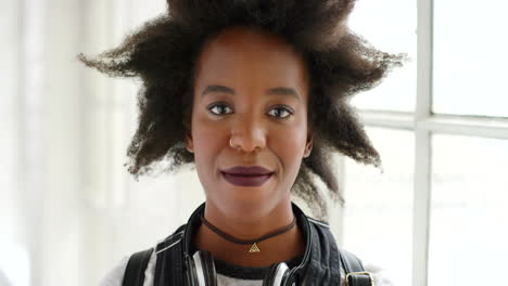 Edgy-young-black-woman-with-stylish-afro-smiling