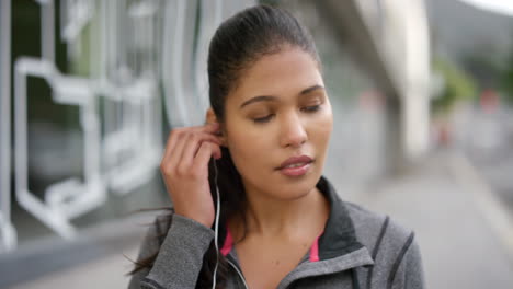 Portrait-of-an-active-woman-listening-to-music