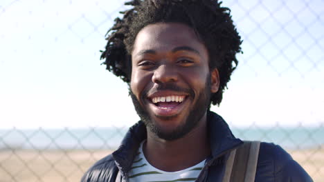 Closeup-portrait-of-a-young-black-man-laughing