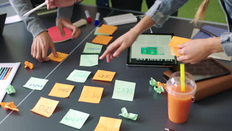 Team,-hands-and-planning-with-sticky-notes