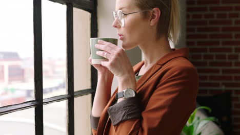 Thinking,-window-and-coffee-with-a-business-woman