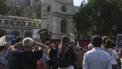 Large-crowd,-including-men-and-women,-standing-with-placards-in-hands-support-the-Leaseholders-Together-Rally-in-Parliament-Square