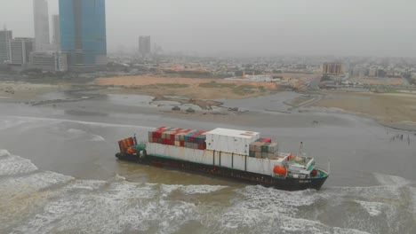 Aerial-Dolly-Parallax-Of-Beached-Cargo-Ship-Heng-Tong-77-On-Overcast-Day