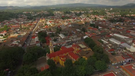 Spectacular-aerial-view-with-drone-of-the-central-Church-of-the-magical-town-Coatepec,-Veracruz