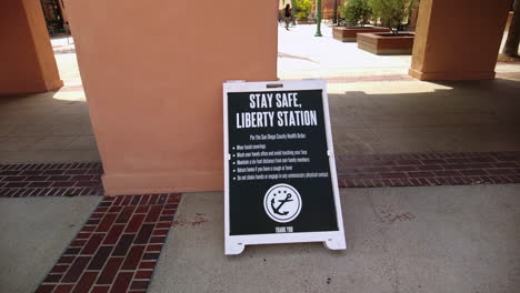 Stay-Safe-Sign-On-Concrete-Floor-In-Liberty-Station,-San-Diego,-California-During-Coronavirus-Pandemic