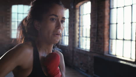 Strong,-determined-woman-boxing-during-her-cardio