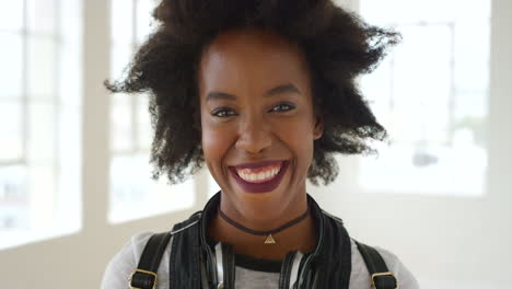 Composite-of-laughing,-edgy-woman-with-an-afro