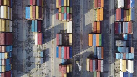Aerial-approach-to-colorful-containers-waiting-at-the-port-in-lock-down