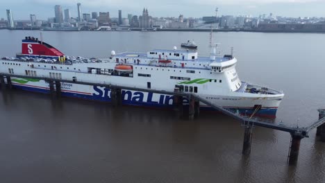Stena-Line-freight-ship-loading-cargo-from-Wirral-terminal-Liverpool-aerial-view-slow-orbit-left