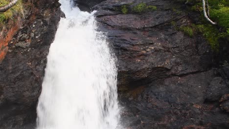 Waterfall-spraying-water-over-rocks
