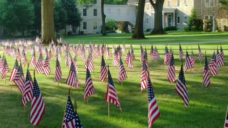 Green-field-with-flags,-Lititz-Moravian-Church,-Lancaster-County-PA-,-Independence-day-concept