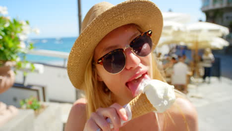 A-young-woman-enjoying-a-cone-of-gelato-on-holiday