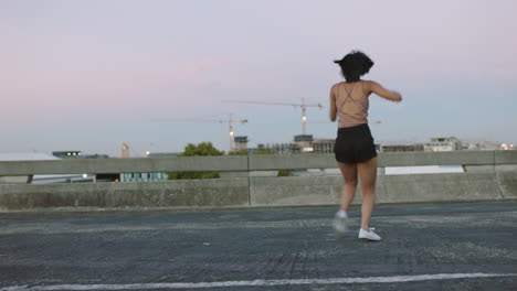 Young-woman-dances-alone-on-empty-street