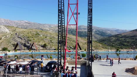 Tourists-Ride-The-Highest-Swing-On-Jabal-Al-Arbaen-In-Al-Dinniyeh-Region,-Lebanon