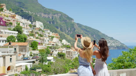 Two-friends-taking-photos-of-the-view-using