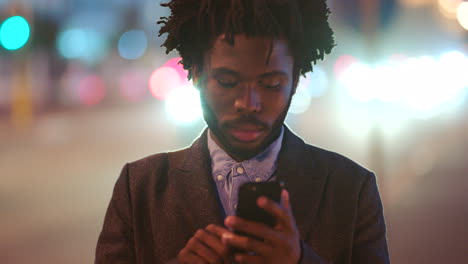 Black-guy-checking-social-media-while-waiting
