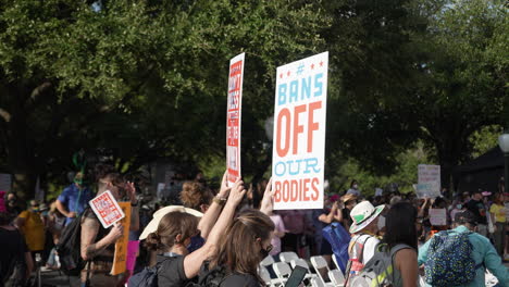 Pro-choice-activists-hold-up-colorful-signs-during-Women's-March-Rally-at-Texas-Capitol-in-Austin,-TX