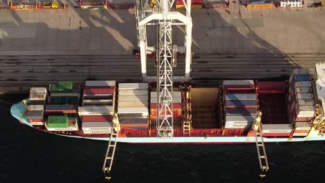 Massive-container-vessel-being-loaded-in-port-of-Vigo,-Spain