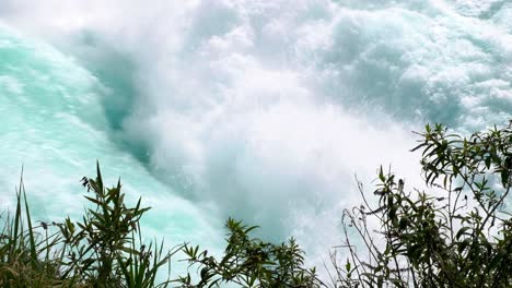 Raging-whitewater-rapid-torrents-of-water-on-Huka-Falls-waterfall-in-Taupo,-New-Zealand-Aotearoa