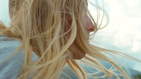 Closeup-of-a-blonde-woman-with-her-hair-blowing