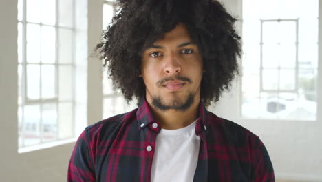 A-young-black-confident-male-with-an-afro-taking