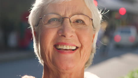 Face-portrait-of-a-laughing-older-woman-looking