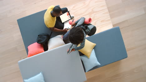 Creative,-wellness-students-studying-on-a-sofa
