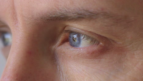 Closeup-of-man-with-blue-eyes-gazing