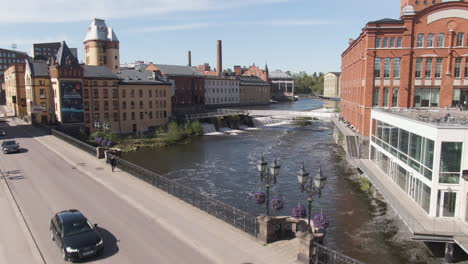 Majestic-bridge-and-river-in-city-of-Norrkoping-with-beautiful-old-town-buildings