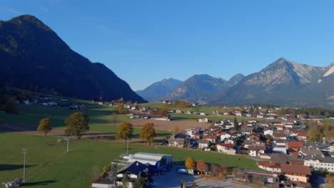 Breathtaking-morning-lift-up-into-vast-blue-sky-in-Tirol-Austria,-drone-lift