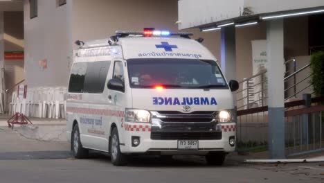 Ambulances-turn-on-emergency-lights-while-transporting-patients-infected-with-Corona-2019-during-the-global-Covid-19-epidemic-situation-in-Nonthaburi,-Thailand