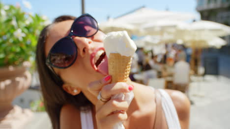A-carefree-young-woman-enjoying-ice-cream