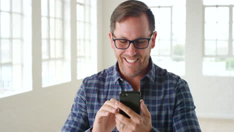 A-modern-business-man-using-his-phone