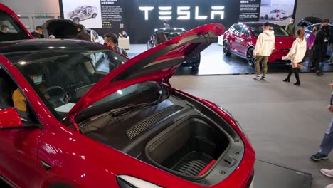 An-open-engine-hood-of-a-Tesla-Model-Y-is-seen-at-the-American-electric-company-car-Tesla-Motors-booth-during-the-International-Motor-Expo-showcasing-EV-electric-cars-in-Hong-Kong