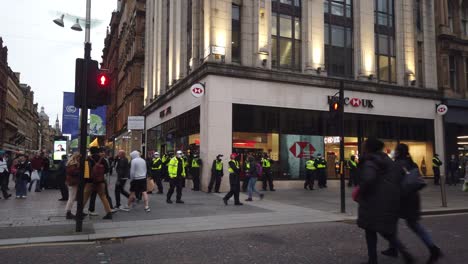 Wide-shot-of-a-group-of-police-officers-protecting-a-British-bank