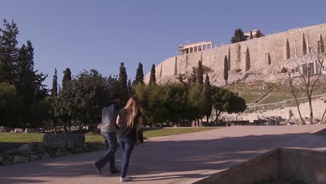 Woman-walking-to-the-Parthenon-at-the-Acropolis,-Athens,-Greece
