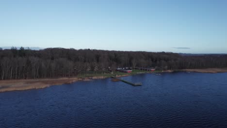 Aerial-View-Of-Skanderborg-Lakein-Denmark,-Fishing-Water,-Beautiful-Lake-and-Forest---Truck-Shot