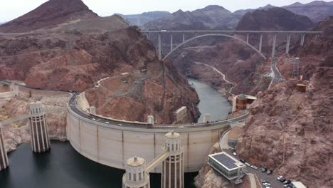 Orbiting-aerial-view-of-the-Hoover-Dam-with-the-Mike-O'Callaghan–Pat-Tillman-Memorial-Bridge-in-sight