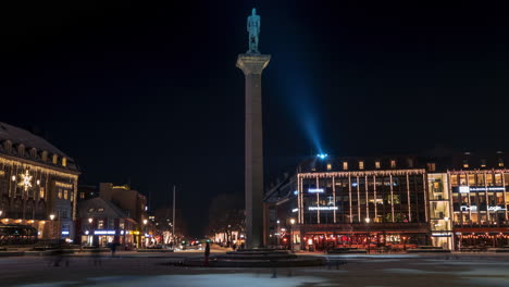 People-walking-across-Trondheim-City-Square-in-Nighttime-showing-the-statue-of-Olav-Tryggvason-in-the-middle-of-the-city-center