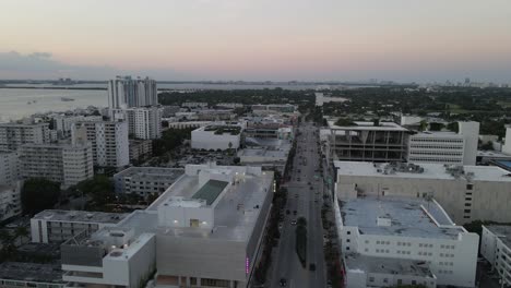 Miami-sunrise-aerial-descent-over-Alton-Rd-to-people-on-top-of-parkade