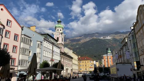 Historical-buildings-with-the-'zum-Heiligen-Geist'-hospital-church-in-the-Maria-Theresien-Straße-of-Innsbruck,-the-capital-city-of-Tyrol-in-Austria