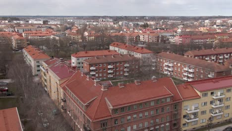 Drone-shot-flying-over-Uppsala-city-in-Sweden-with-houses-and-apartments
